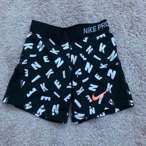 black and white letter nike pros
